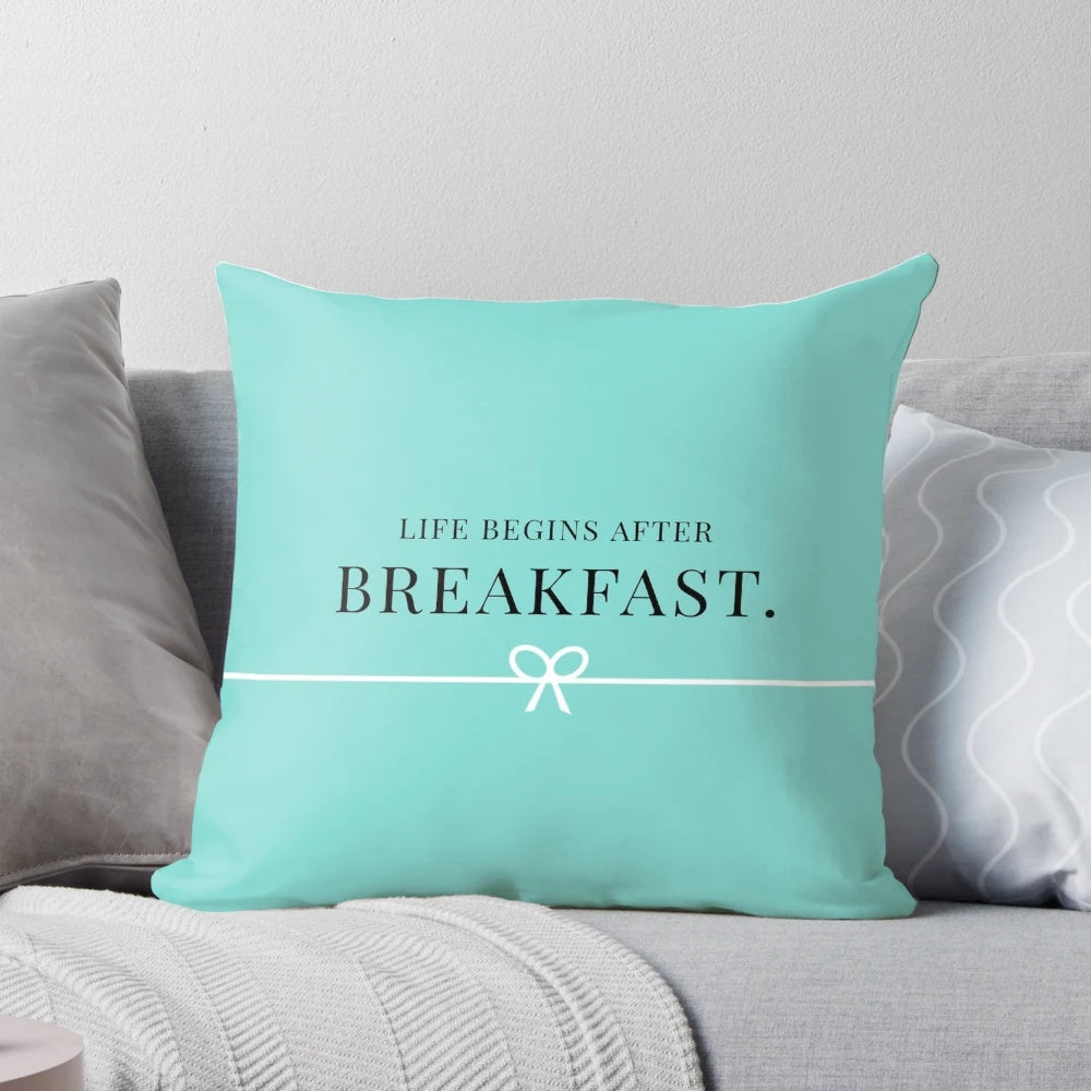 A decorative breakfast-themed pillow with a Tiffany-inspired design, perfect for adding a girly touch to any space.