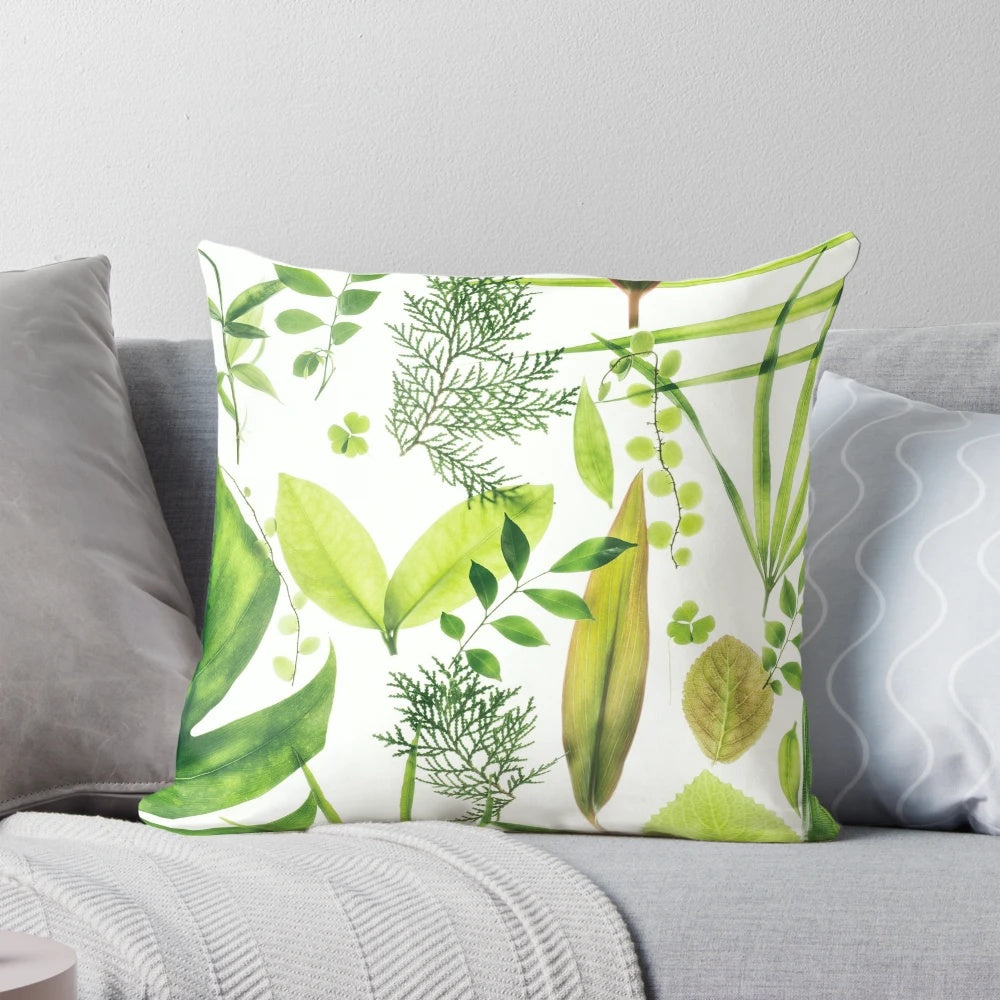 Closeup of a lush, translucent green foliage pillow with a botanical, nature-inspired design.