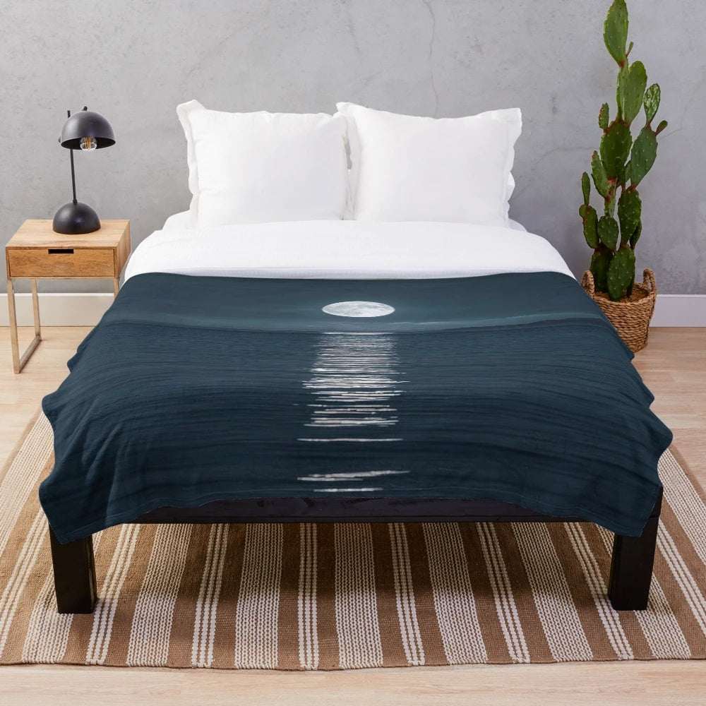 Plush blanket with a stunning moonlit seascape design