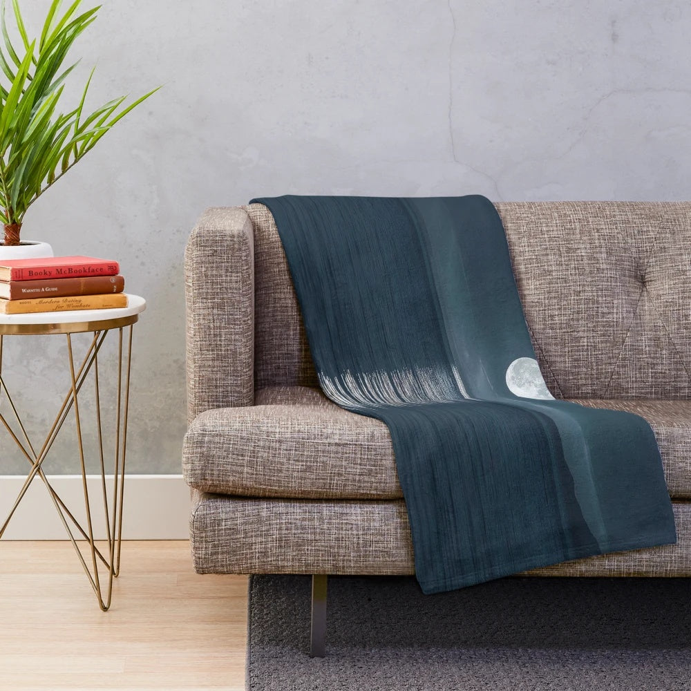 Plush blanket with a stunning moonlit seascape design