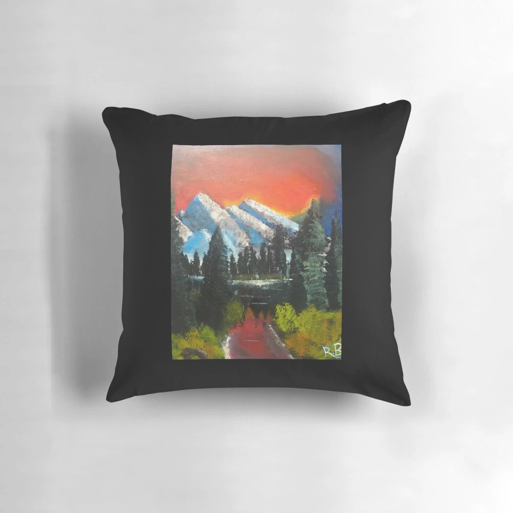 Sunset Serenity Pillow featuring a hand-painted landscape with mountains, water, and a serene river scene