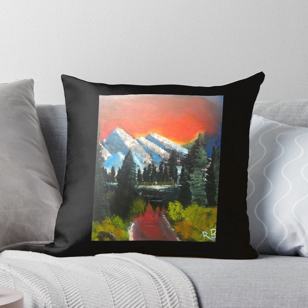 Sunset Serenity Pillow featuring a hand-painted landscape with mountains, water, and a serene river scene