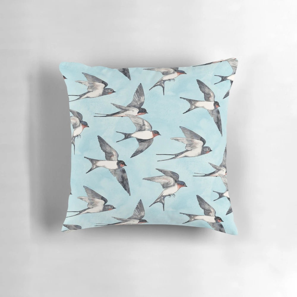 Watercolor painting of swallows in flight against a blue sky, decorative pillow for home