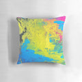 Bright and colorful pillow with shades of yellow, blue, and pink for a vibrant home accent.