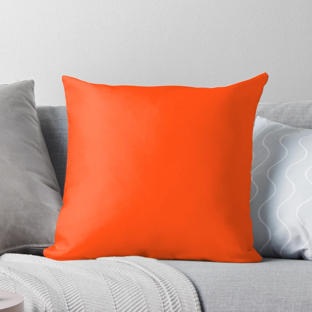 Bright fluorescent orange neon throw pillow with a bold and vibrant design, perfect for modern home decor.