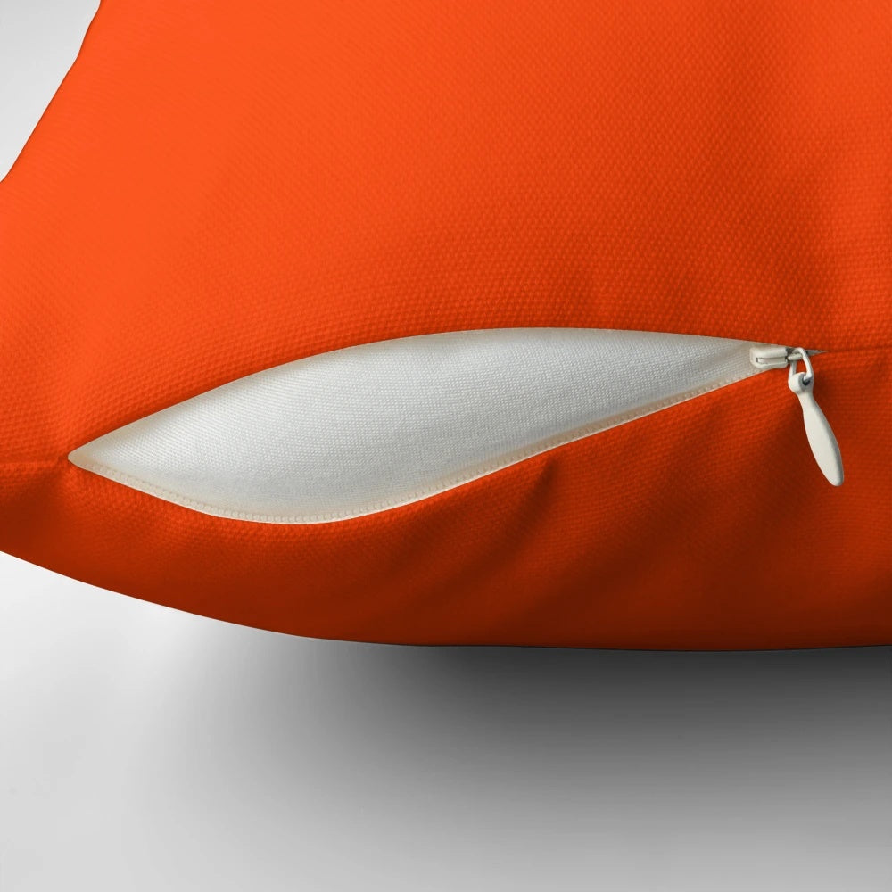Bright fluorescent orange neon throw pillow with a bold and vibrant design, perfect for modern home decor.