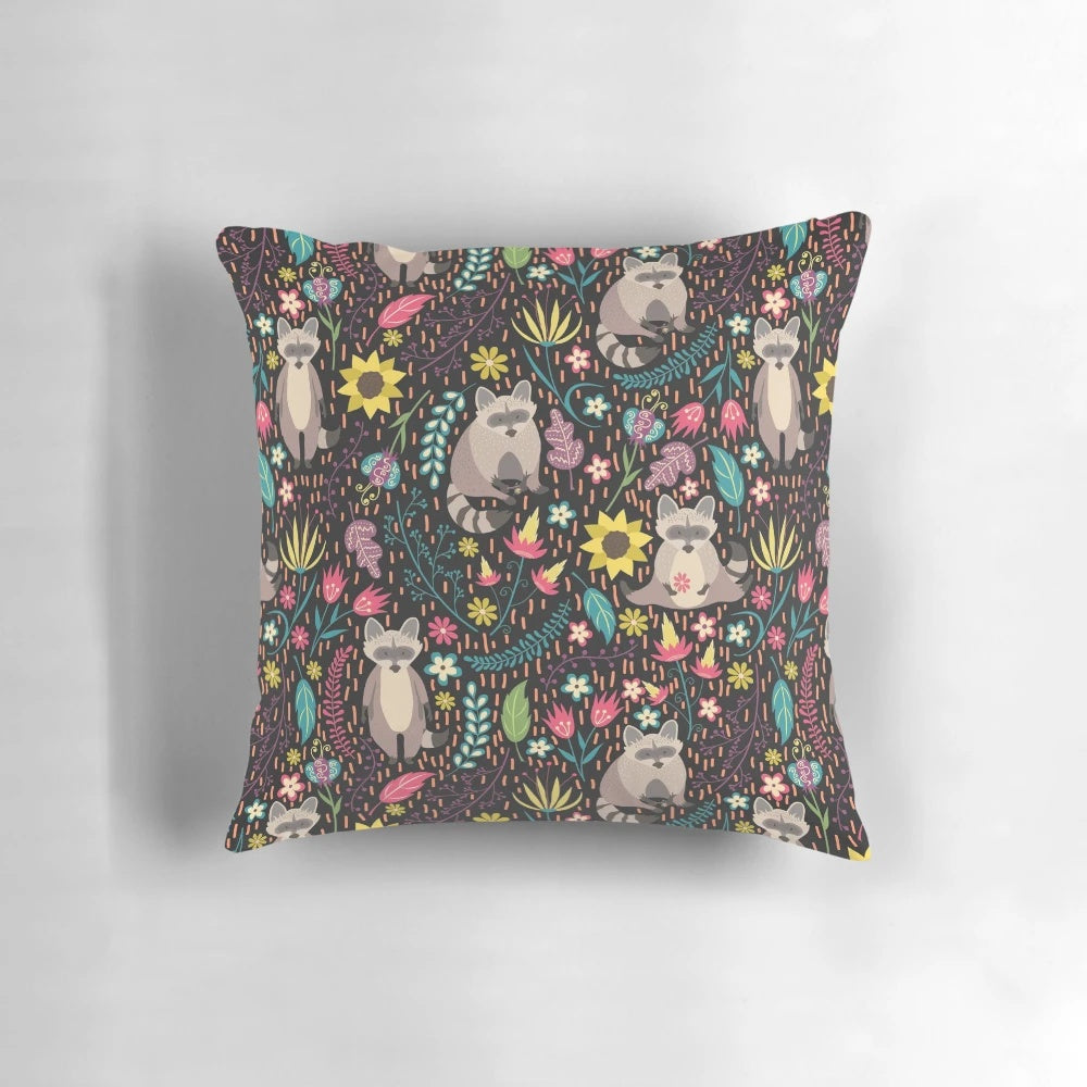 Vibrant pillow with a whimsical raccoon design in a floral and leaf pattern