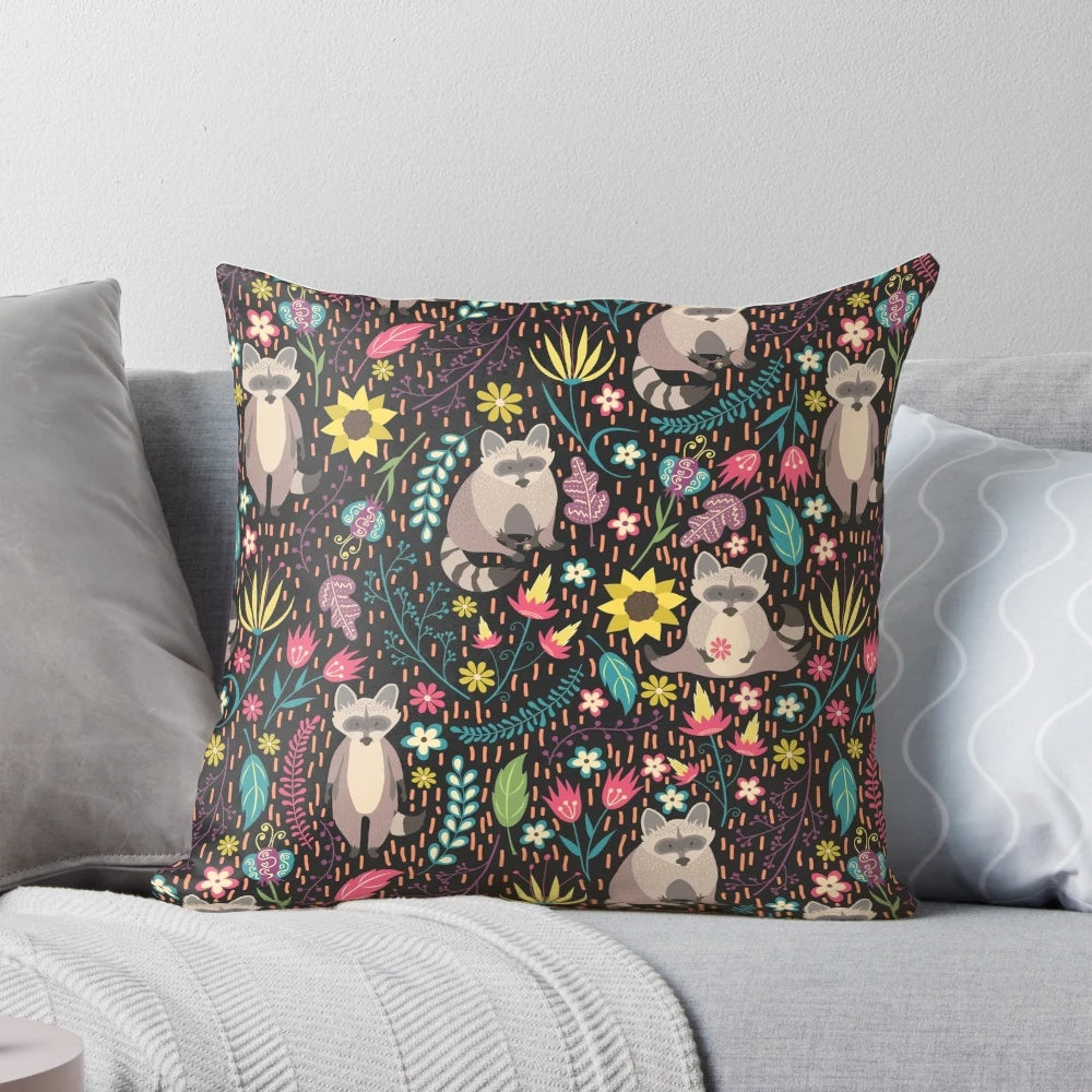 Vibrant pillow with a whimsical raccoon design in a floral and leaf pattern