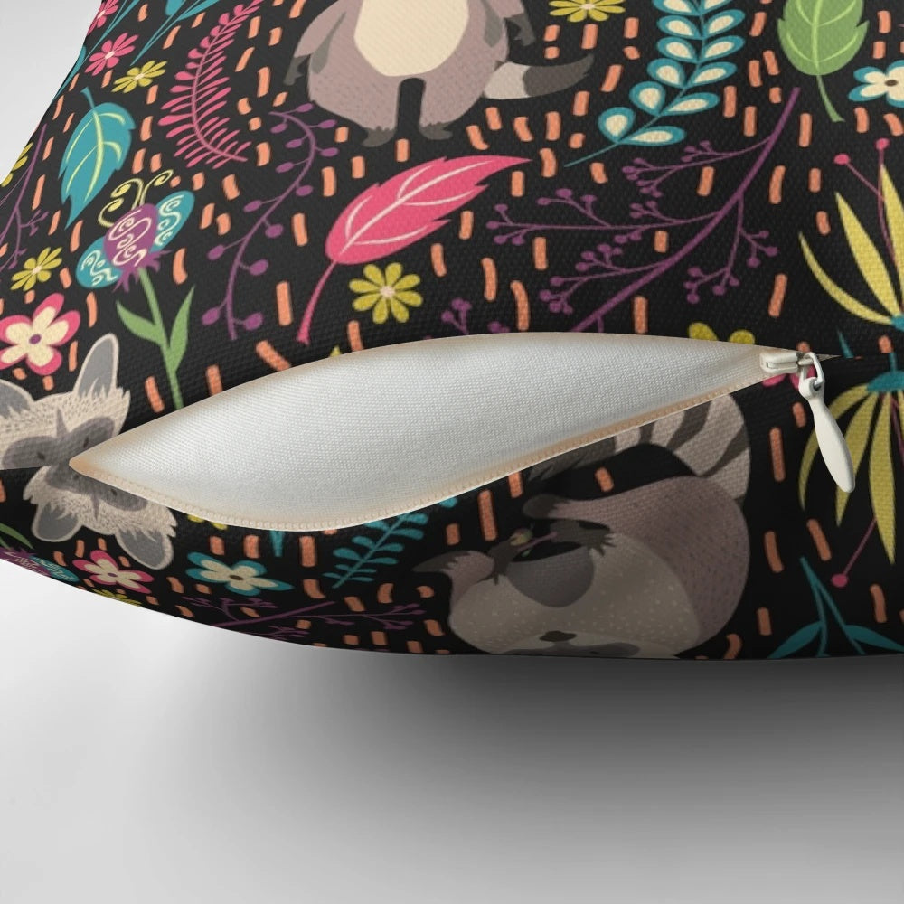 Vibrant pillow with a whimsical raccoon design in a floral and leaf pattern