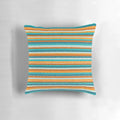 A vibrant and textured summer striped pillow in shades of orange, rust, turquoise, teal, and white.
