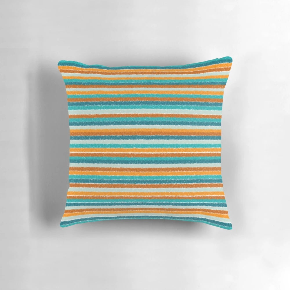 A vibrant and textured summer striped pillow in shades of orange, rust, turquoise, teal, and white.