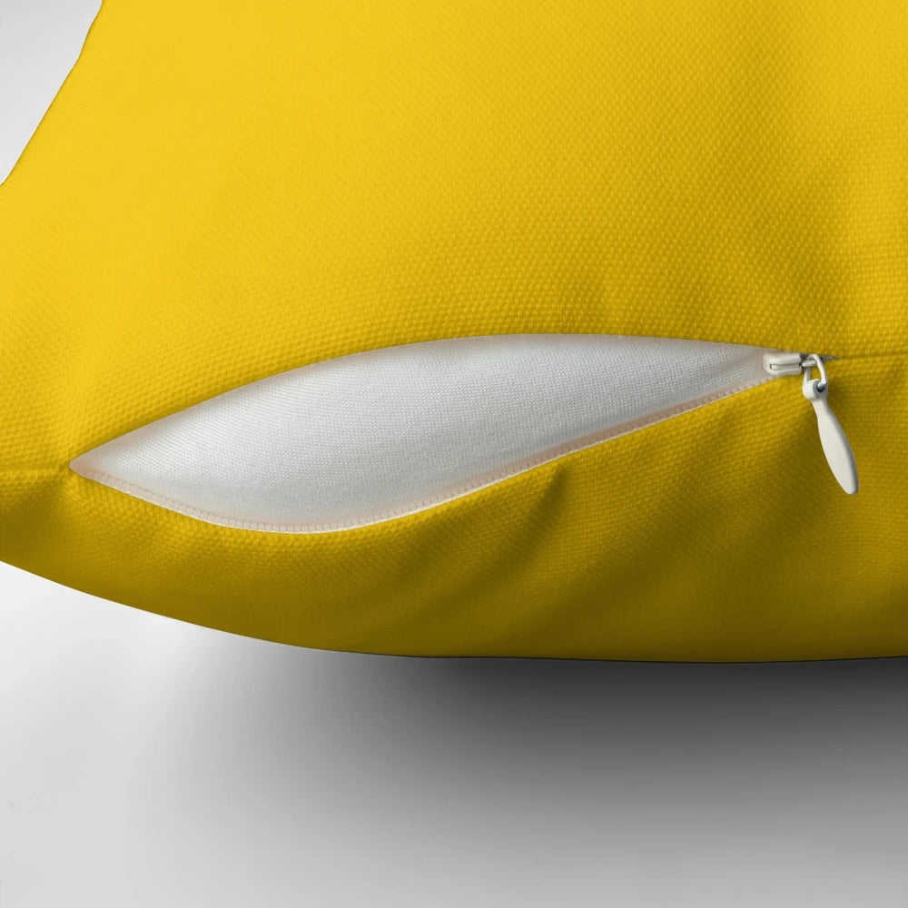 Bright yellow solid pillow with sunny, vibrant design