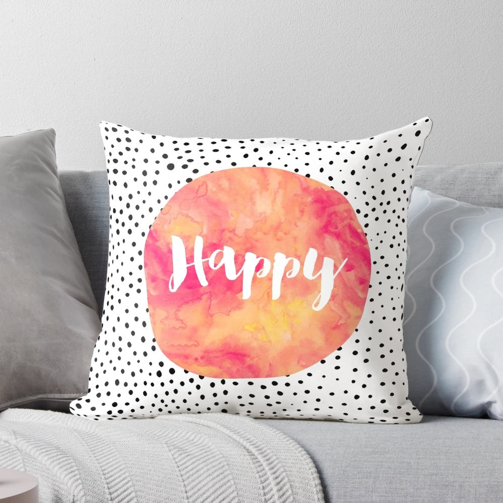 A colorful pillow with a happy, inspirational quote and playful polka dots design