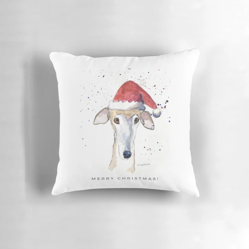 Brindle sighthound wearing a Christmas hat, a cozy pillow design for greyhound and galgo espanol dog lovers.