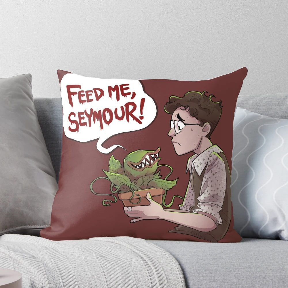 A cozy and decorative pillow featuring the famous carnivorous plant Audrey II from the musical "Little Shop of Horrors