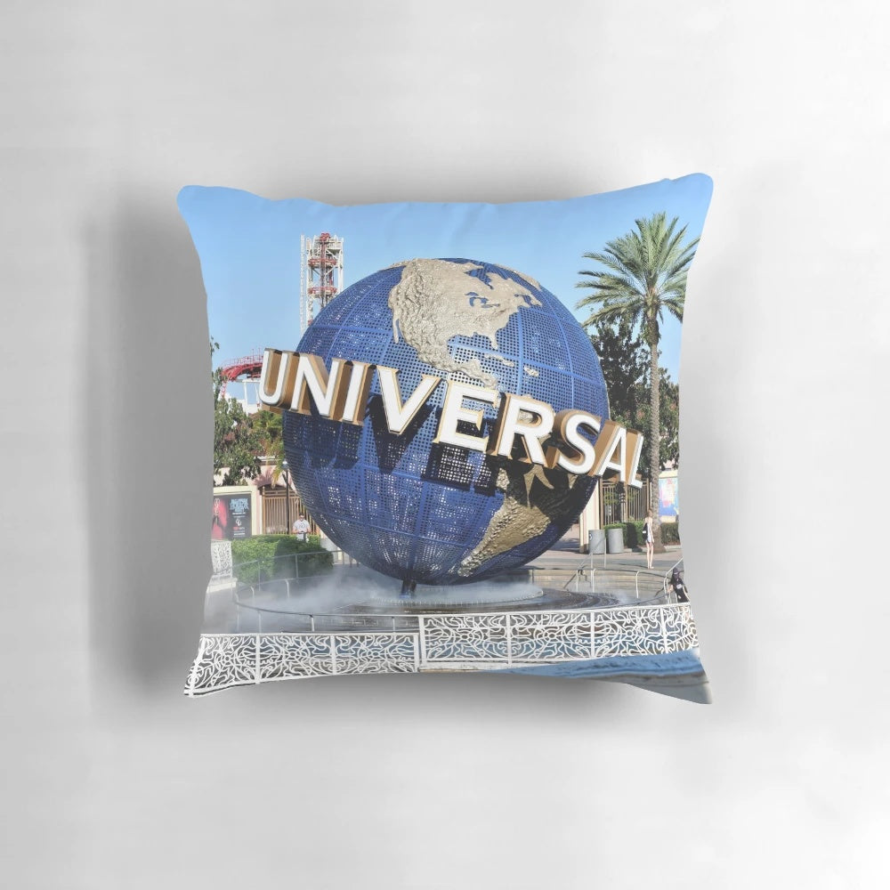 Soft and plush Universal Studios globe pillow featuring the iconic blue earth design