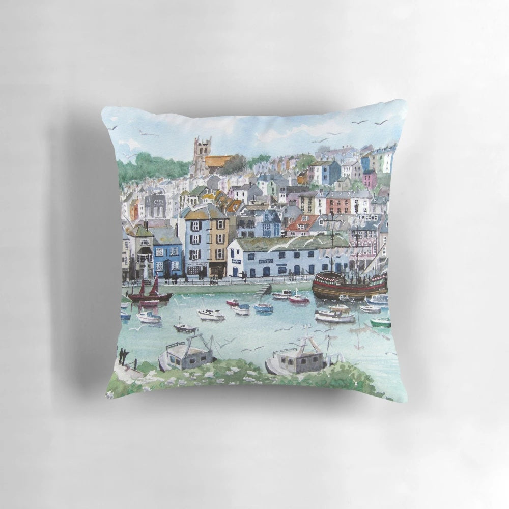 Cozy pillow featuring a picturesque fishing village scene in Brixham, Devon, England.