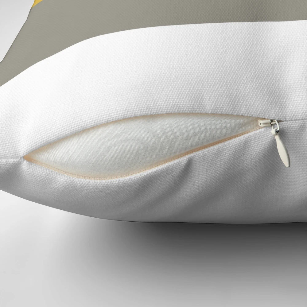 Broad stripes pattern in mustard yellow, grey, and navy blue on a modern, minimalist pillow