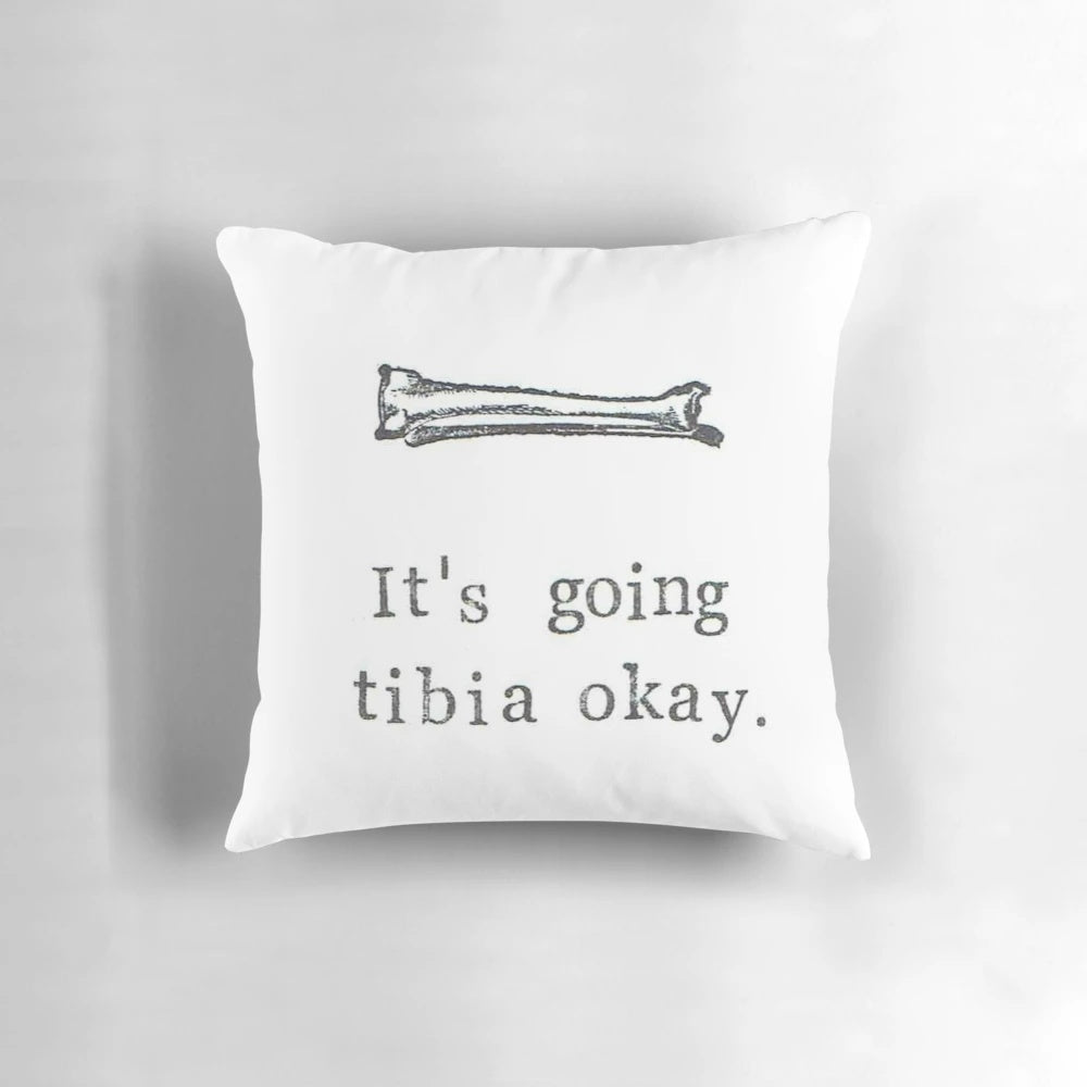 An image of a pillow with a graphic of a tibia bone and the text "It's Going Tibia Okay".