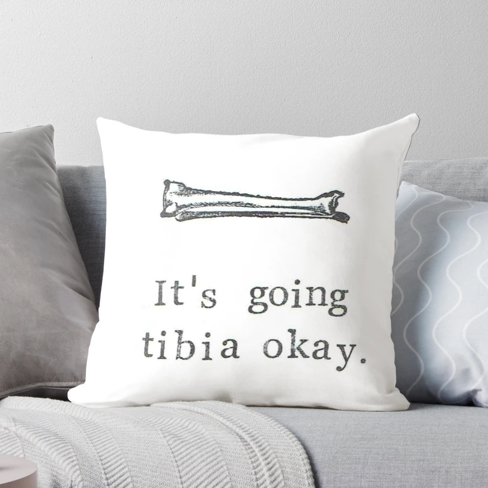 An image of a pillow with a graphic of a tibia bone and the text "It's Going Tibia Okay".