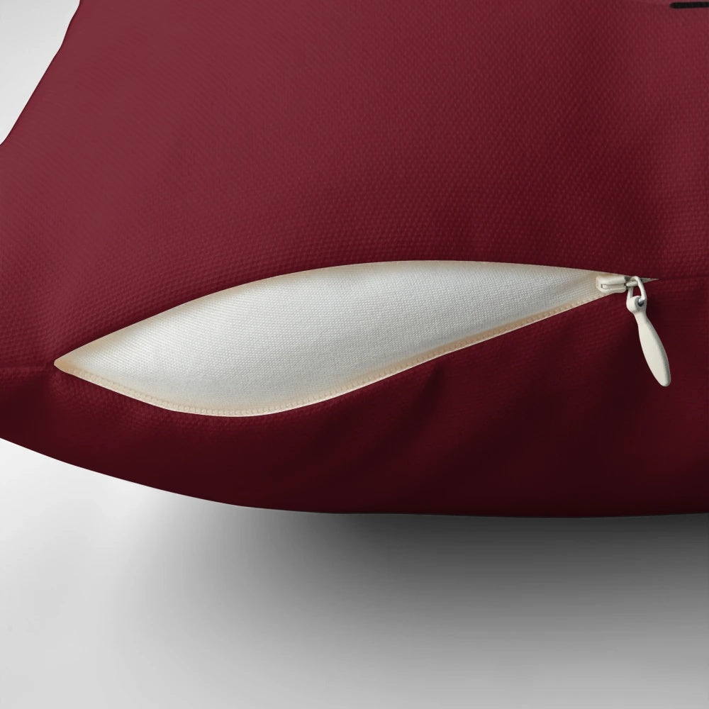 Pillow featuring a graphic, brutally beaten and bloody face with a disturbing expression