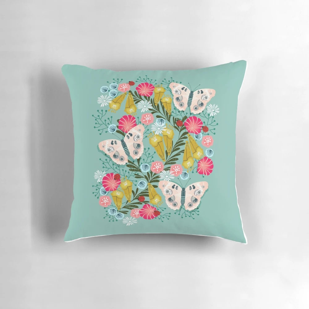 Buckeye butterfly print throw pillow with vibrant floral design