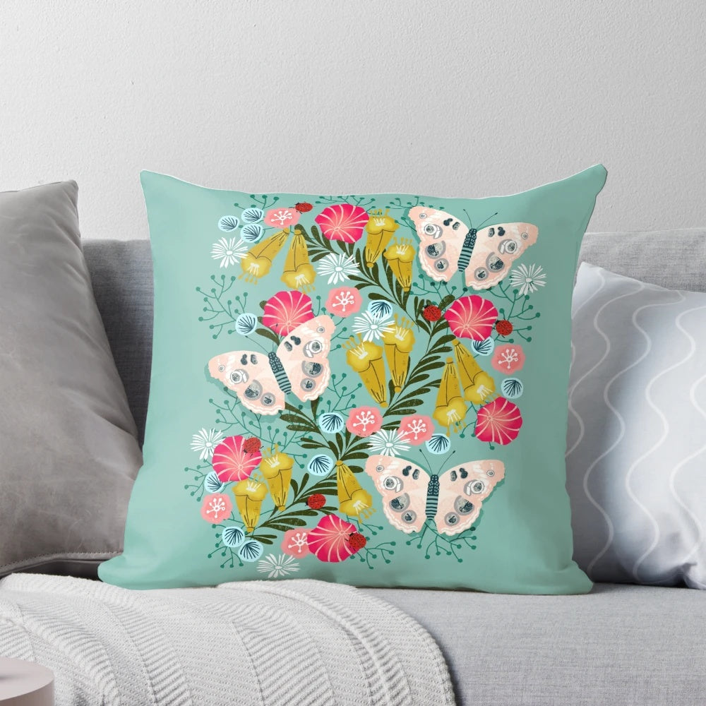 Buckeye butterfly print throw pillow with vibrant floral design