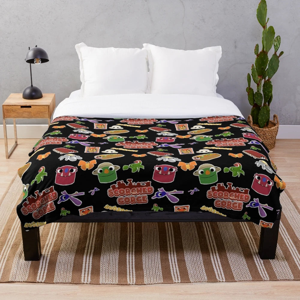 Bugsnax inspired Scorched Gorge plush blanket featuring characters like Bunger, Strabby, and Grumpus