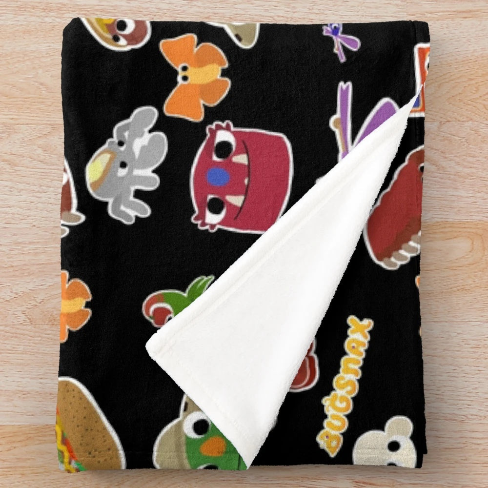 Bugsnax inspired Scorched Gorge plush blanket featuring characters like Bunger, Strabby, and Grumpus