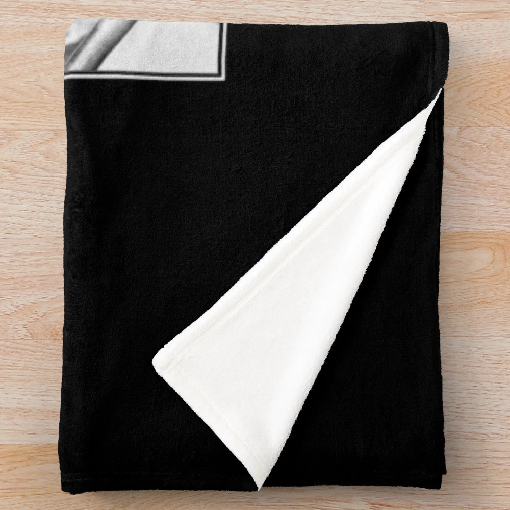 Buster Keaton in his iconic movie The Navigator, in black and white, on a plush blanket