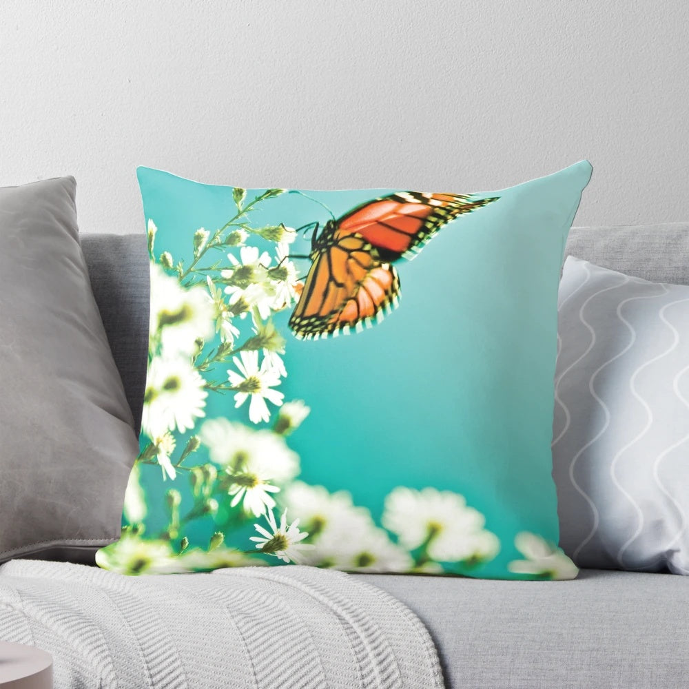 Beautifully designed throw pillow featuring a butterfly and flowers in a nature-inspired pattern.
