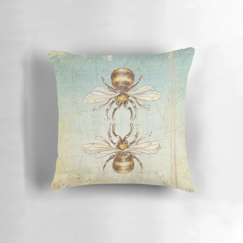 Colorful and whimsical bee pillow featuring a surreal, grunge-style design