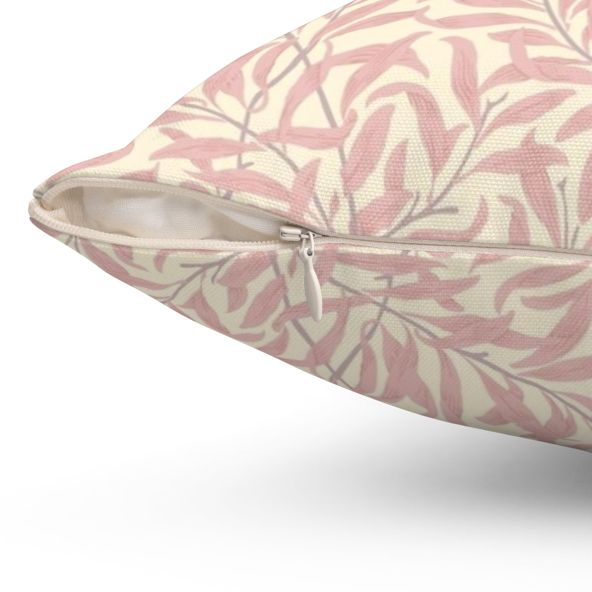 A pink and cream colored throw pillow featuring a vintage-inspired willow bough and leaf pattern, based on the textile designs of William Morris. - Detail