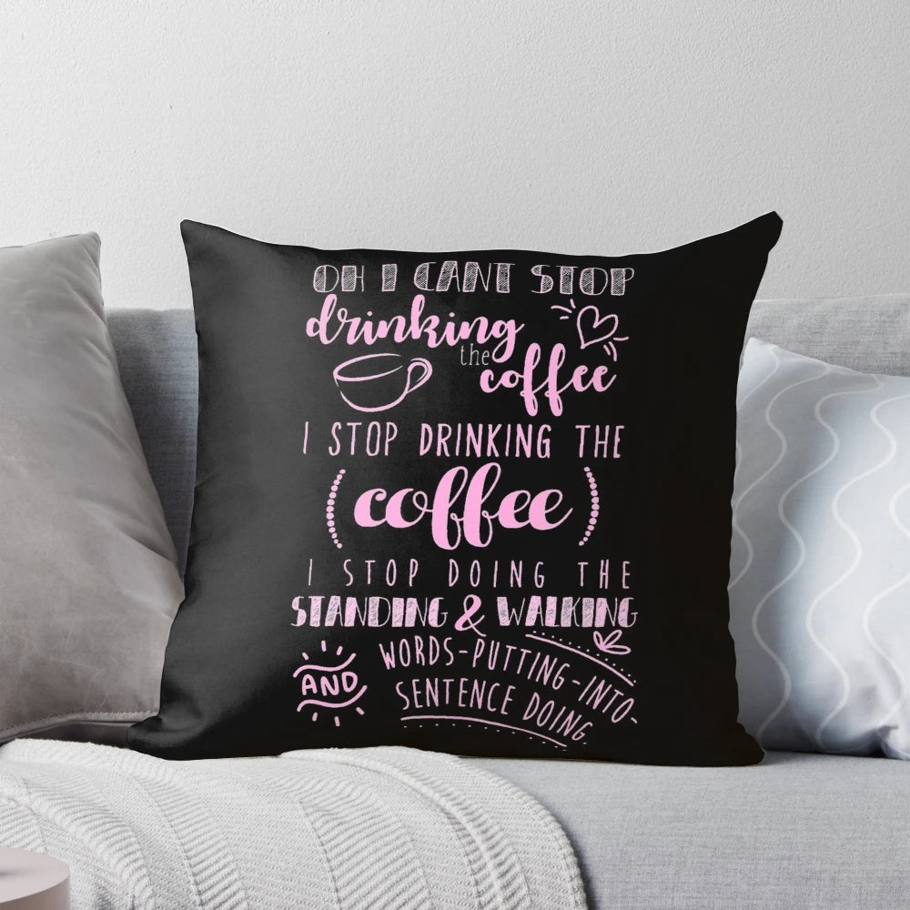 A pink pillow featuring a coffee-themed design, perfect for coffee lovers.