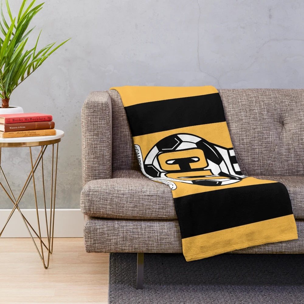 Cambridge United FC logo inspired plush blanket with striped design