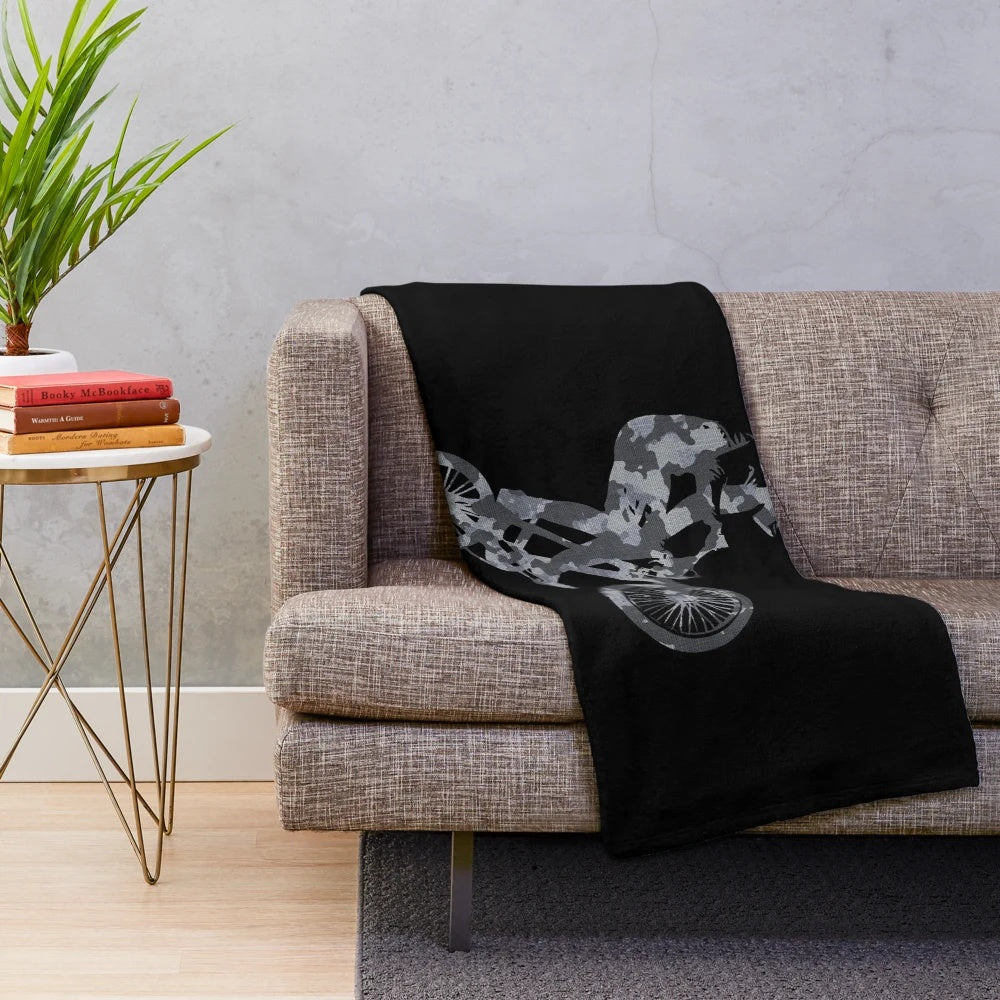 Camouflage patterned plush blanket for BMX enthusiasts