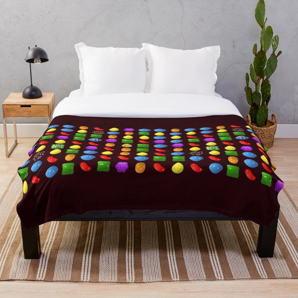 Candy-themed plush blanket with soft and cozy design