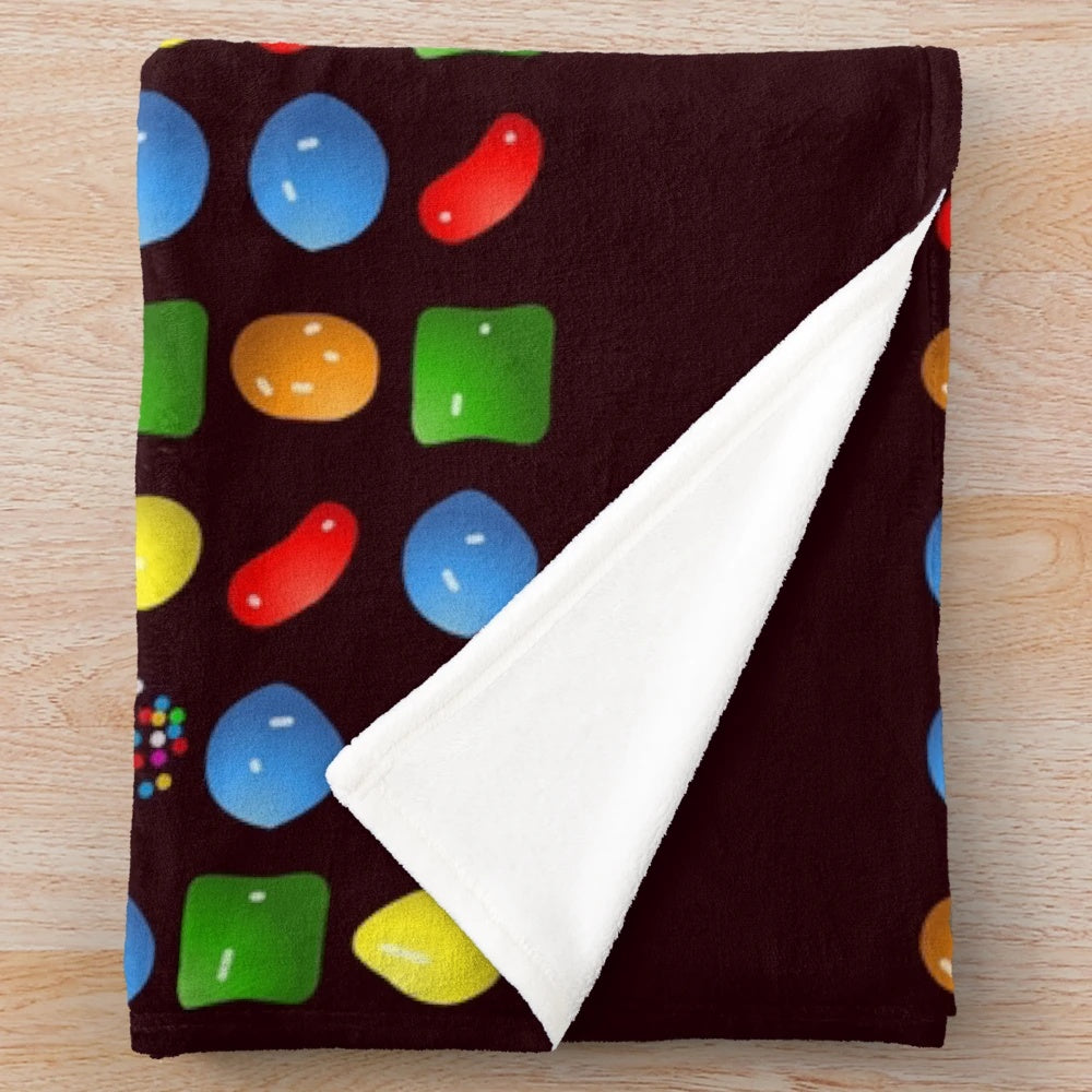 Candy-themed plush blanket with soft and cozy design