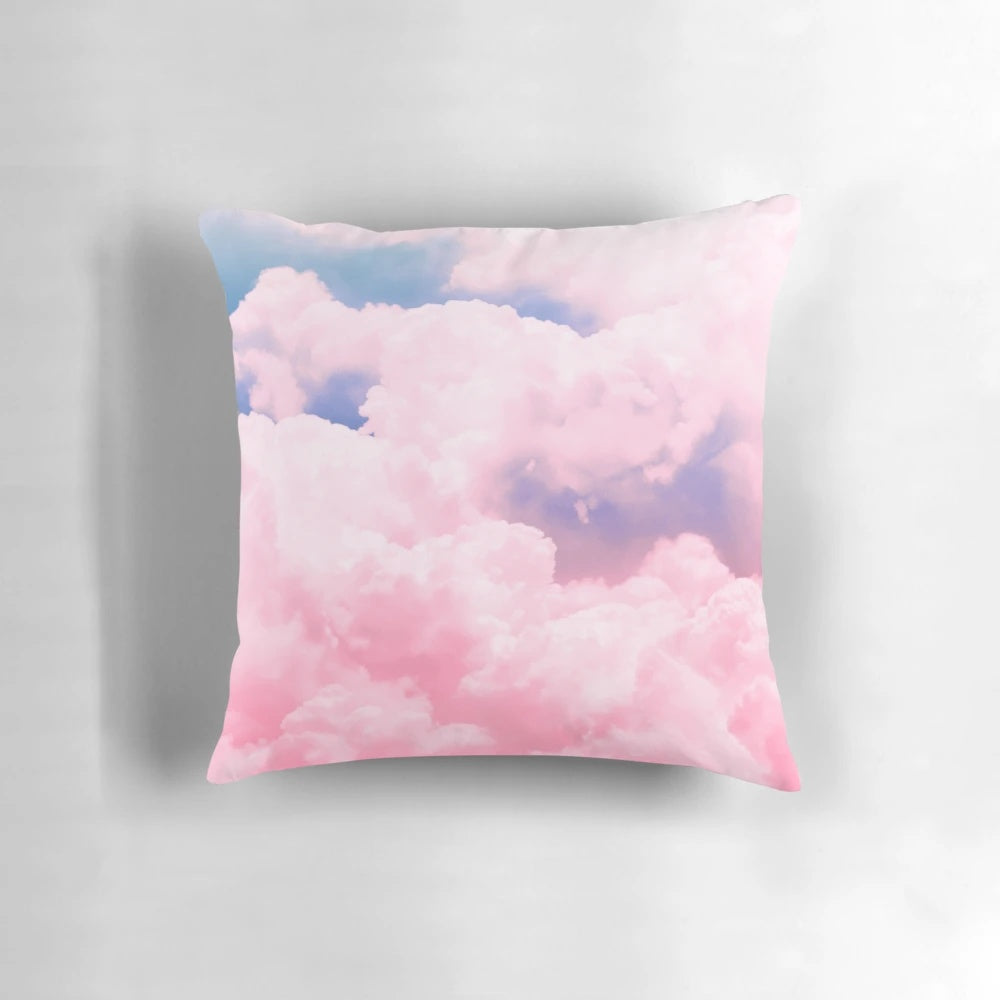Soft, fluffy cloud-patterned pillow in shades of pink, blue, and white