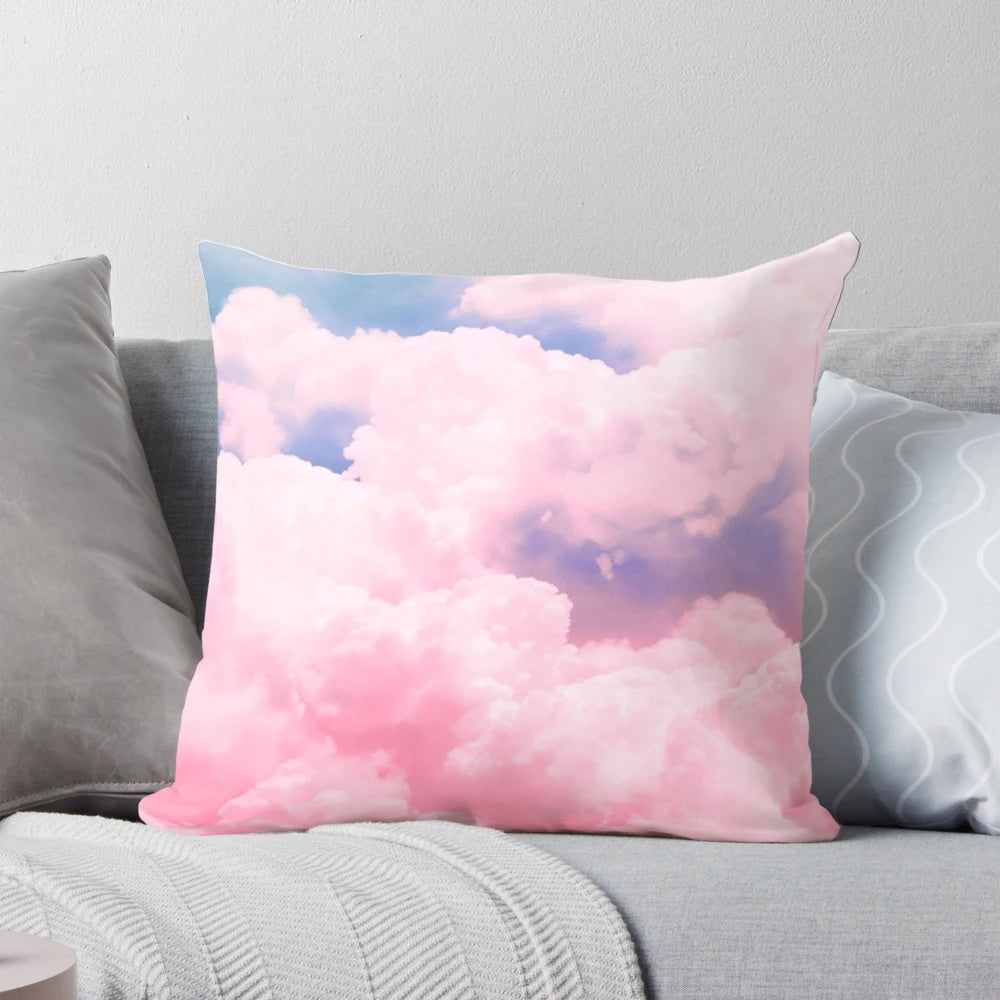 Soft, fluffy cloud-patterned pillow in shades of pink, blue, and white