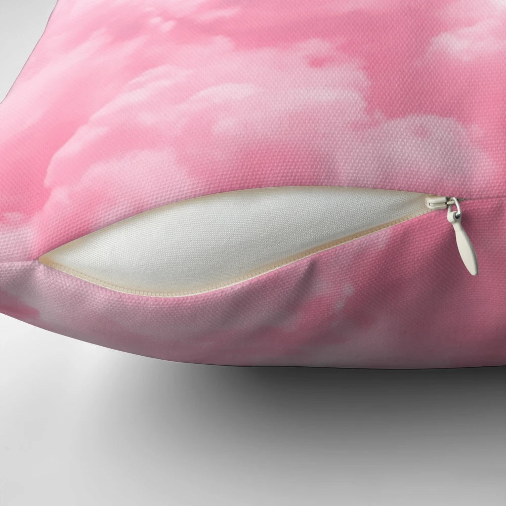 Soft, fluffy cloud-patterned pillow in shades of pink, blue, and white