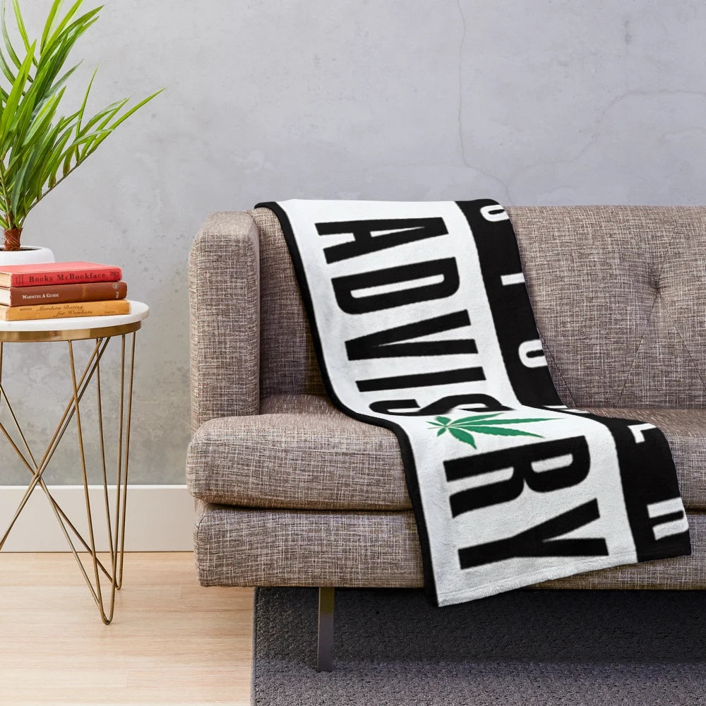 Cannabis-themed plush blanket with marijuana leaf and reggae-inspired design