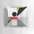 A black and white abstract geometric pillow with red and yellow accents, showcasing a modern Bauhaus-inspired design.