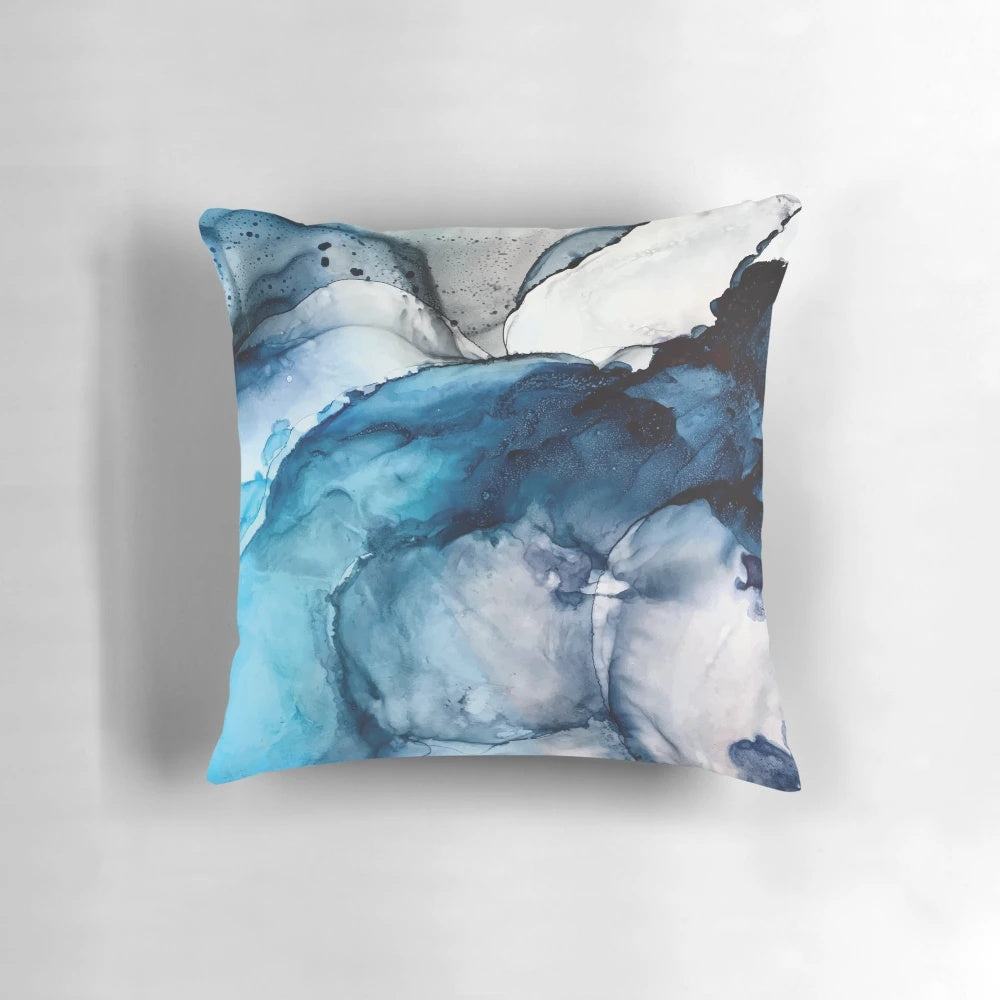 Vibrant abstract alcohol ink painting depicting a serene ocean landscape with waves, sand, and calming blue tones.