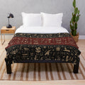 Ancient Egyptian hieroglyphic plush blanket in black, red, and gold