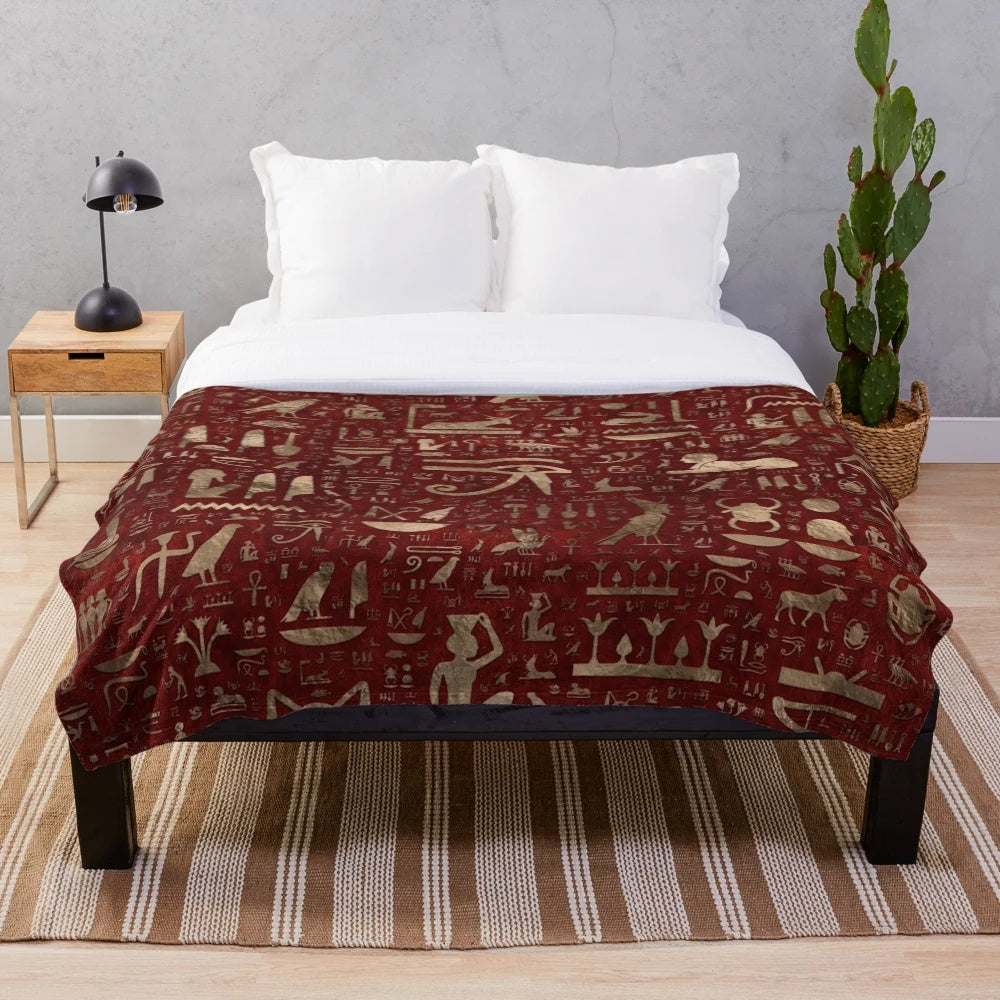 Plush blanket featuring ancient Egyptian hieroglyphic designs