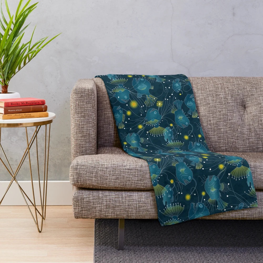 Soft plush blanket featuring a detailed angler fish design