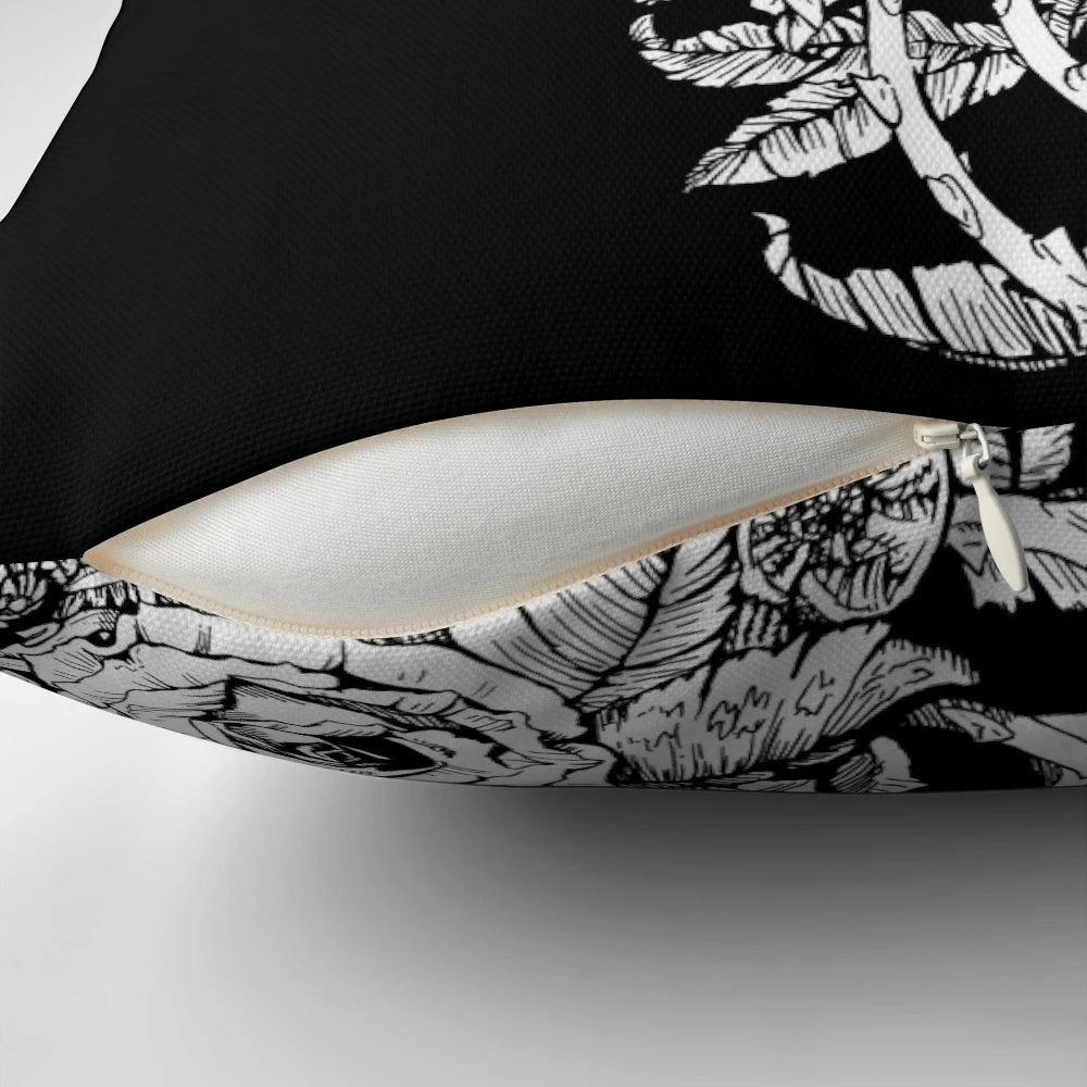 A black and white pillow with a design featuring a fox surrounded by roses and floral elements