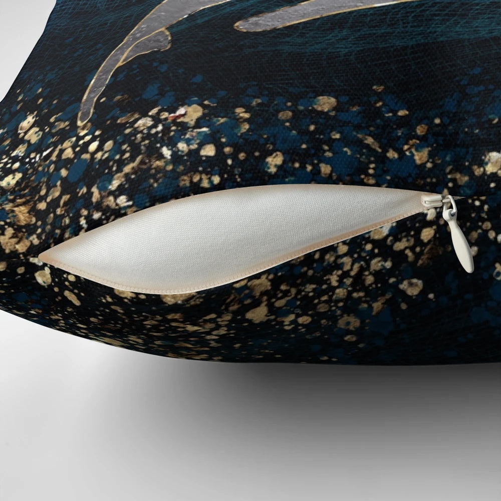 Pillow featuring a contemporary, abstract design of a whale pod in the ocean.