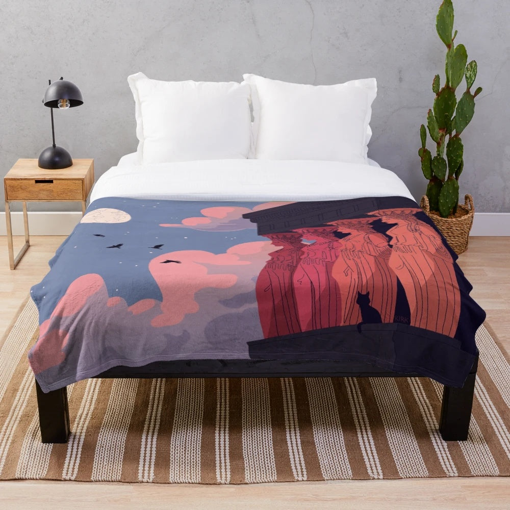 Caryatid figures at dusk on a soft, plush blanket